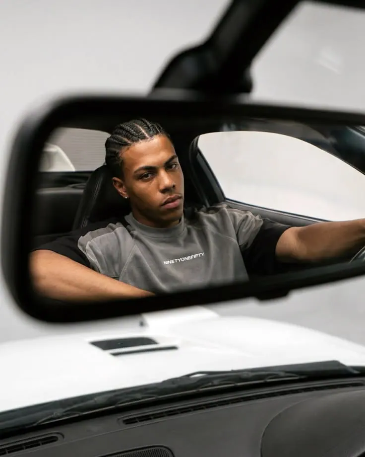 A portrait in a white car mirror — men's portrait