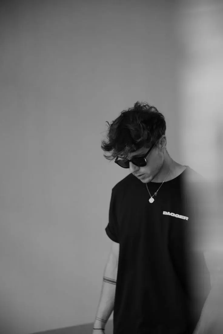 An oversized tee in black and white — men's portrait