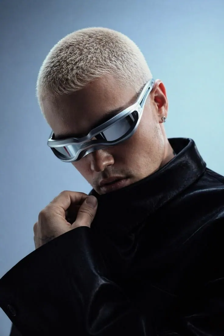A silver visor and platinum buzz cut — men's portrait