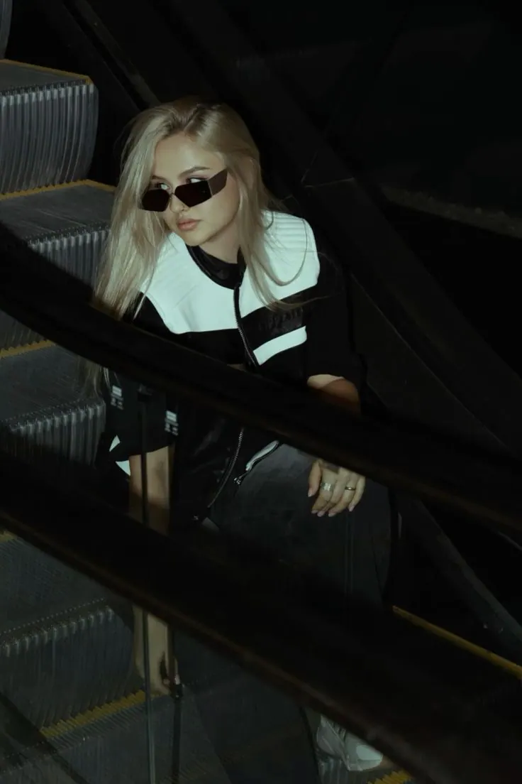 A reflection on the escalator — women's portrait