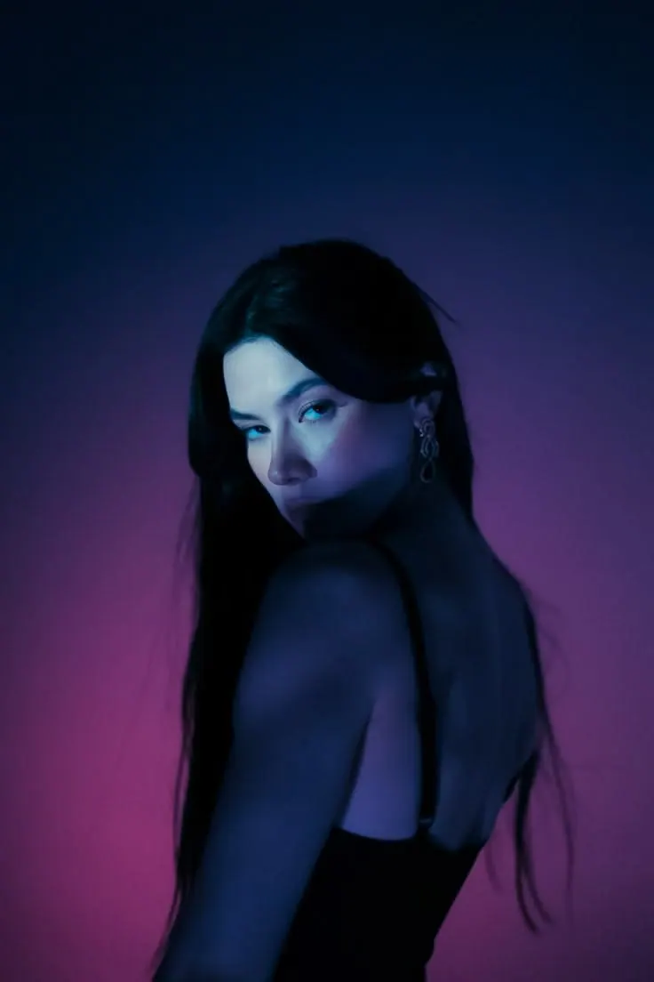 A profile in blue and violet light — women's portrait