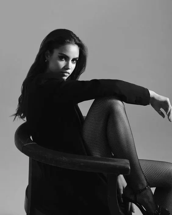 A black look in a mesh chair — women's portrait