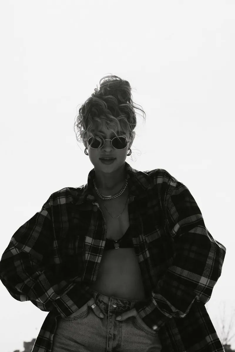 A checked jacket in a black and white portrait — women's portrait