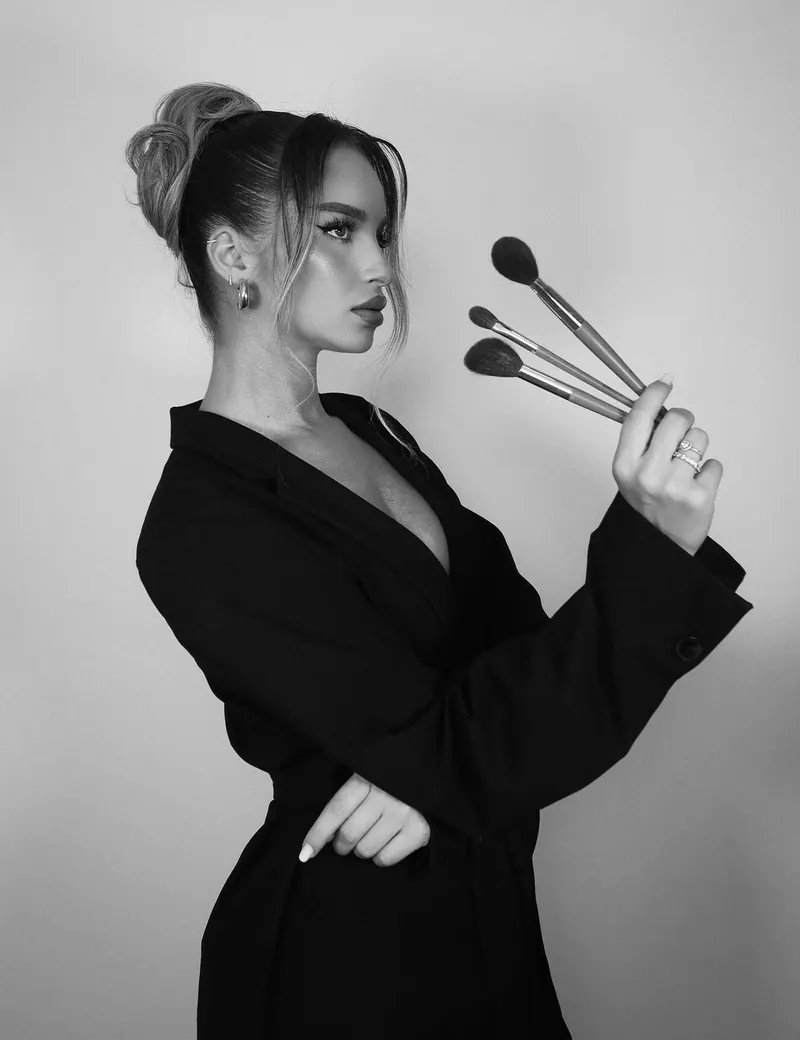 Makeup artist photoshoot — makeup brushes in a black and white beauty portrait