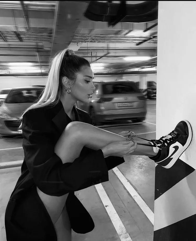 Sportswear in a black and white car park — women's portrait