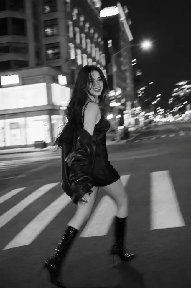 A night crosswalk in black and white — women's portrait