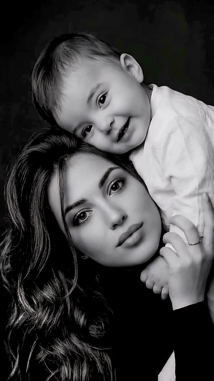 A mother and child in a gentle black and white portrait — couple photo